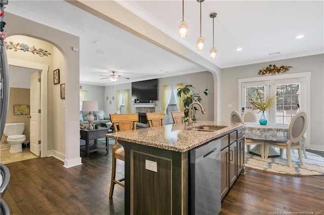 kitchen with decorative light fixtures, dishwasher, dark wood-type flooring, and ceiling fan