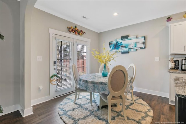 dining area featuring dark hardwood / wood-style floors