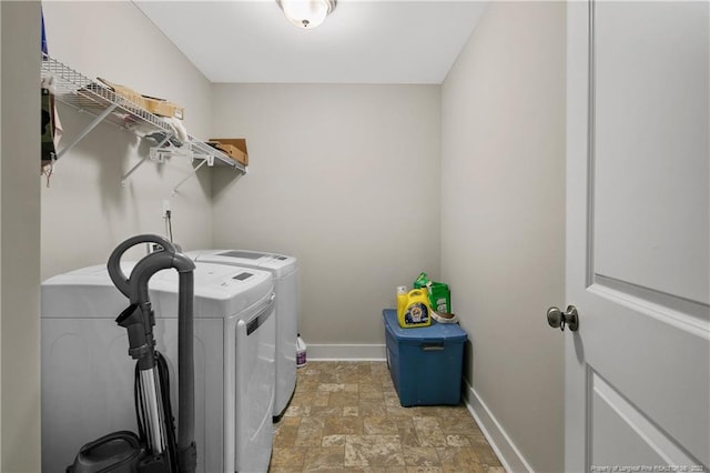 washroom featuring light tile flooring and separate washer and dryer