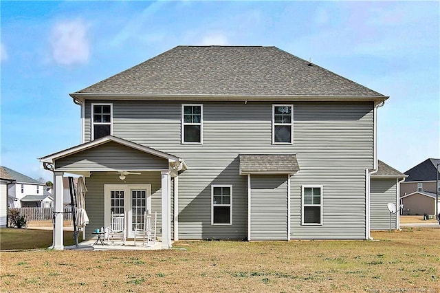 back of house featuring a patio area and a yard