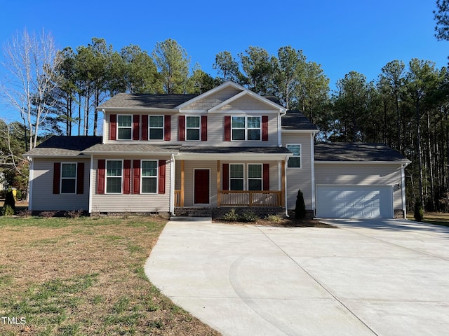 view of front facade with a front yard, a porch, and a garage