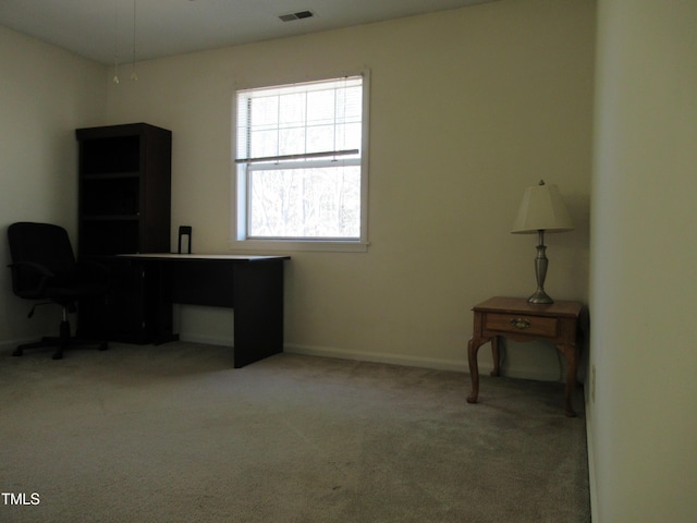 home office featuring carpet floors, visible vents, and baseboards