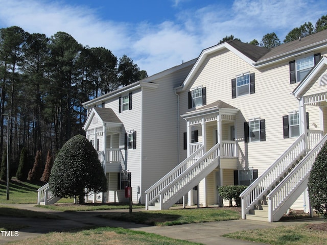 view of front facade featuring stairway