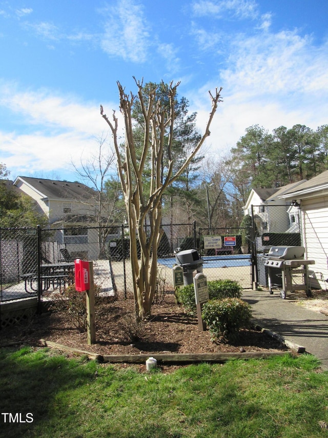 view of yard with fence and a gate