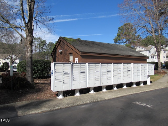 view of home's community featuring mail area