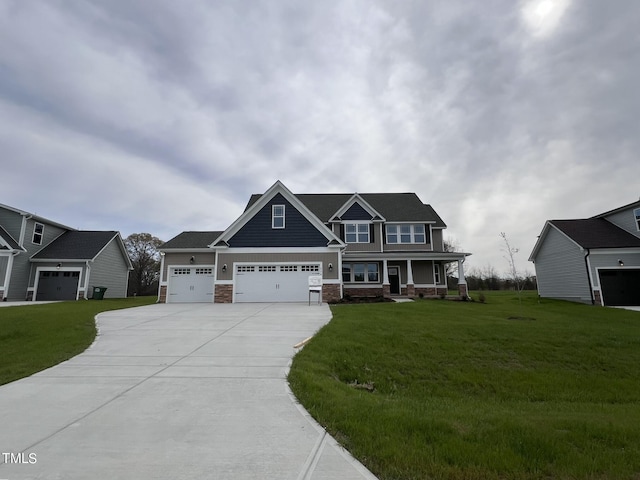 craftsman house with a garage, covered porch, and a front yard