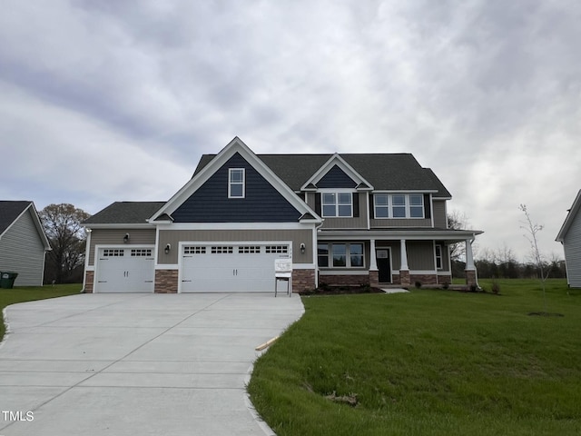 craftsman-style home featuring a porch, a garage, and a front yard