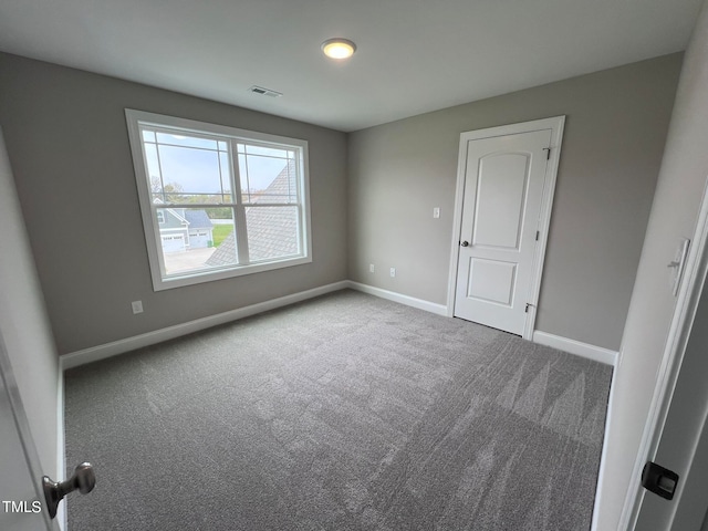 empty room featuring carpet floors