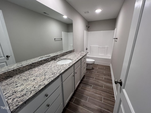 full bathroom featuring shower / tub combination, vanity, and toilet