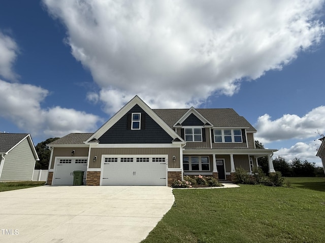 craftsman-style house featuring a garage and a front lawn