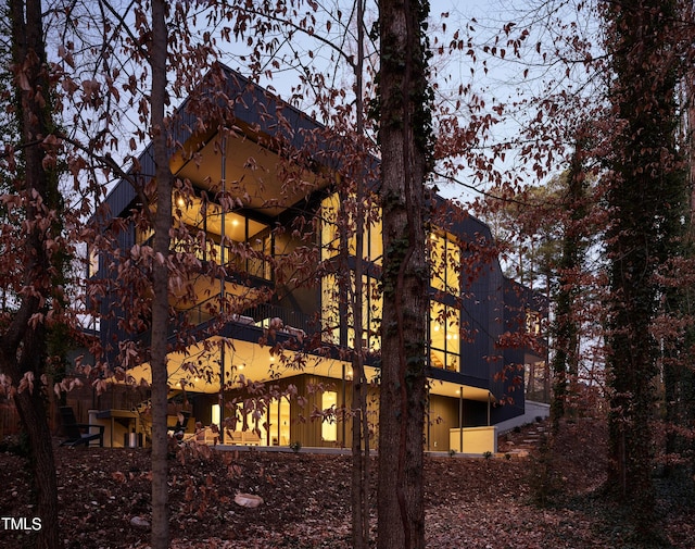 view of side of home featuring a balcony