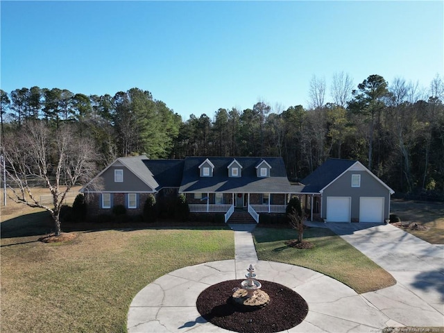 cape cod-style house with a porch, a garage, and a front lawn