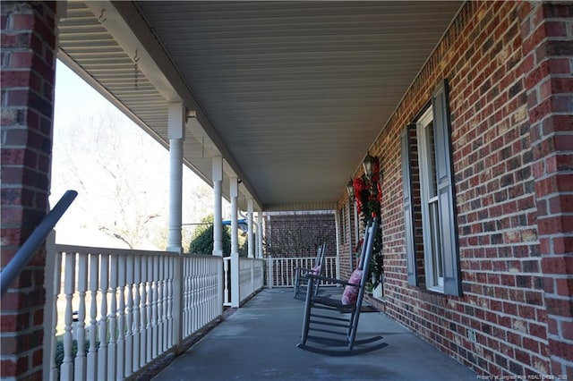 view of patio featuring a porch