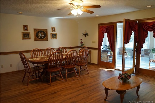 dining space featuring hardwood / wood-style floors, plenty of natural light, a textured ceiling, and ceiling fan