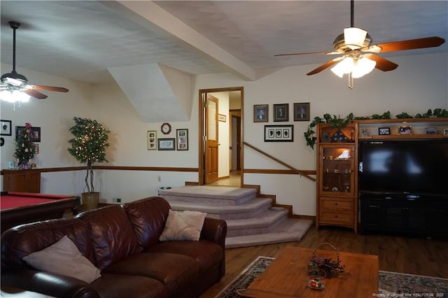 living room featuring ceiling fan, dark hardwood / wood-style floors, beam ceiling, and billiards