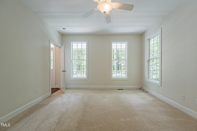 carpeted empty room with ceiling fan