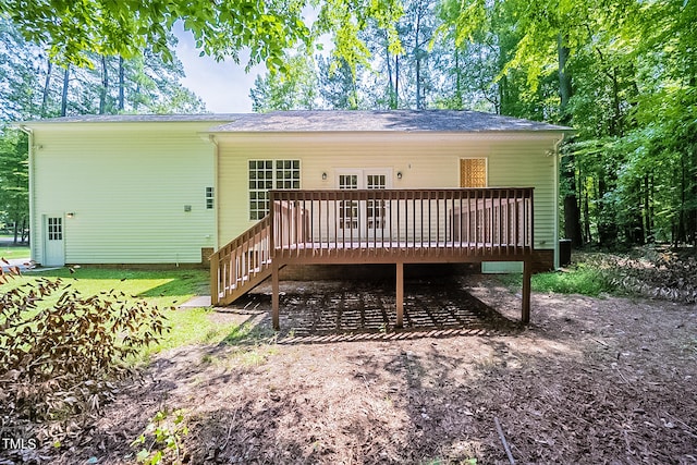 back of house featuring a wooden deck