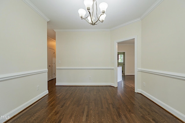 unfurnished room with dark hardwood / wood-style floors, ornamental molding, and an inviting chandelier