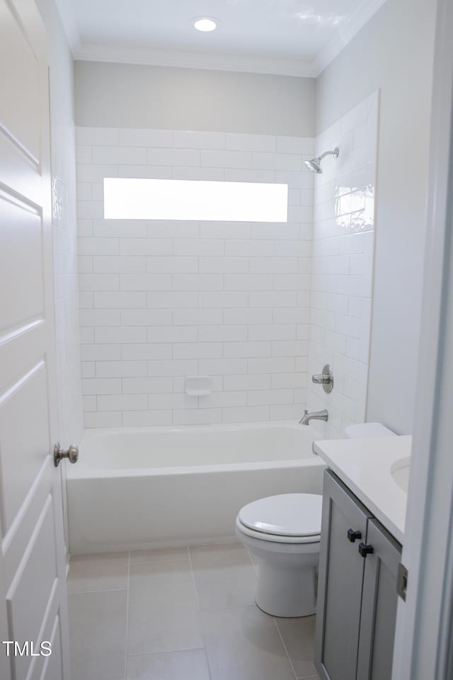 full bathroom with vanity, crown molding, tiled shower / bath, tile patterned flooring, and toilet