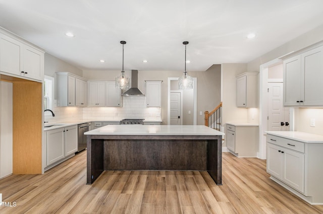 7327 Shawan Rd, Wendell, NC 27591 - kitchen with wall chimney range hood, dishwasher, stove, tasteful backsplash, and light wood-style flooring