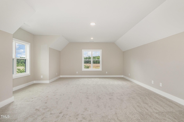 7327 Shawan Rd, Wendell, NC 27591 - additional living space with light colored carpet, lofted ceiling, baseboards, and recessed lighting