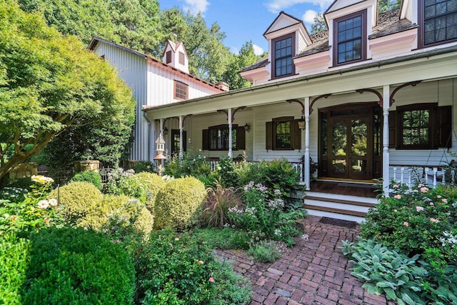 doorway to property featuring covered porch