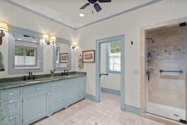 bathroom featuring tile patterned flooring, ceiling fan, a wealth of natural light, and double sink vanity