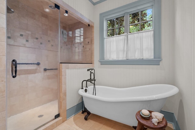 bathroom with shower with separate bathtub and tile patterned floors