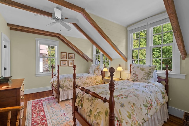 bedroom featuring hardwood / wood-style flooring, multiple windows, and ceiling fan