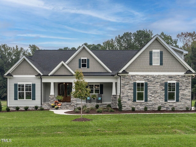 craftsman-style house featuring a front yard and a porch