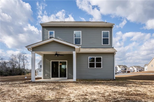 back of property featuring a patio and ceiling fan