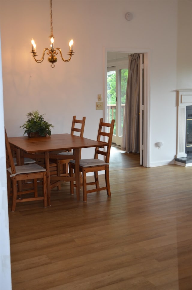 dining room featuring a notable chandelier and hardwood / wood-style floors