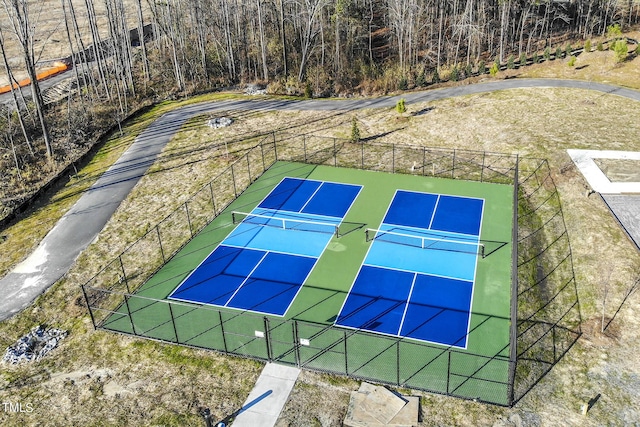 view of sport court featuring fence