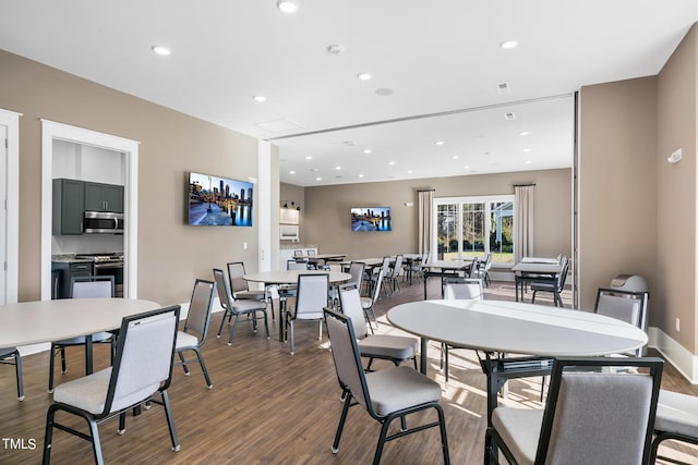 dining area with dark wood-type flooring, recessed lighting, and baseboards