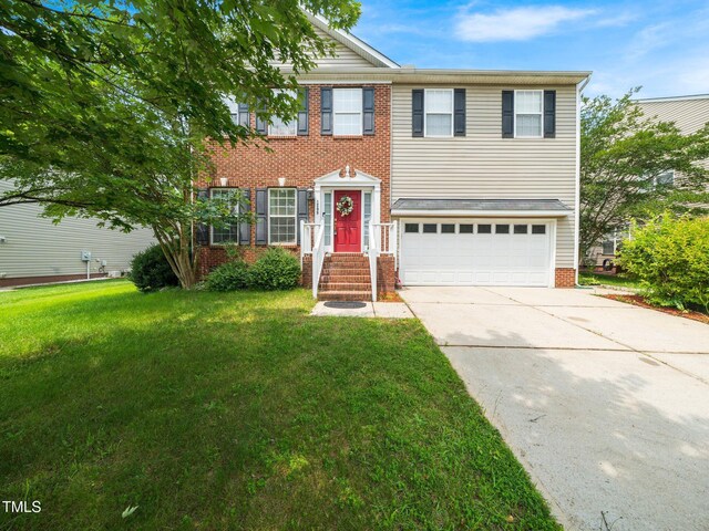 1209 Partington St, Wake Forest, NC 27587 - view of front facade featuring an attached garage, concrete driveway, brick siding, and a front yard