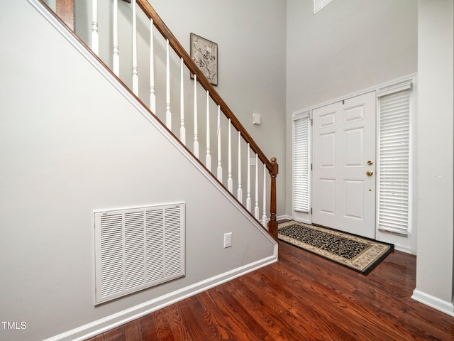 1209 Partington St, Wake Forest, NC 27587 - entrance foyer with a towering ceiling, wood finished floors, baseboards, and stairway