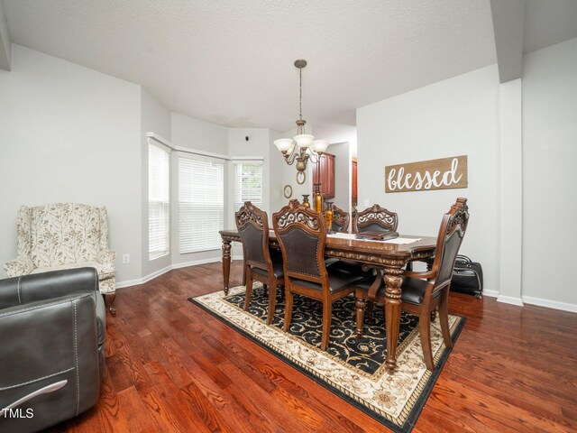 1209 Partington St, Wake Forest, NC 27587 - dining room featuring a chandelier, dark wood finished floors, and baseboards