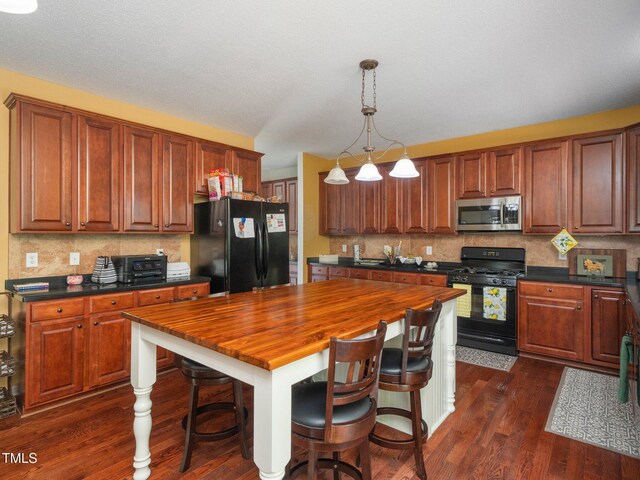 1209 Partington St, Wake Forest, NC 27587 - kitchen with black appliances, dark wood-style floors, wooden counters, and backsplash