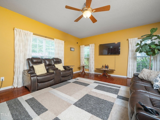 1209 Partington St, Wake Forest, NC 27587 - living area featuring wood finished floors, a ceiling fan, healthy amount of natural light, and baseboards