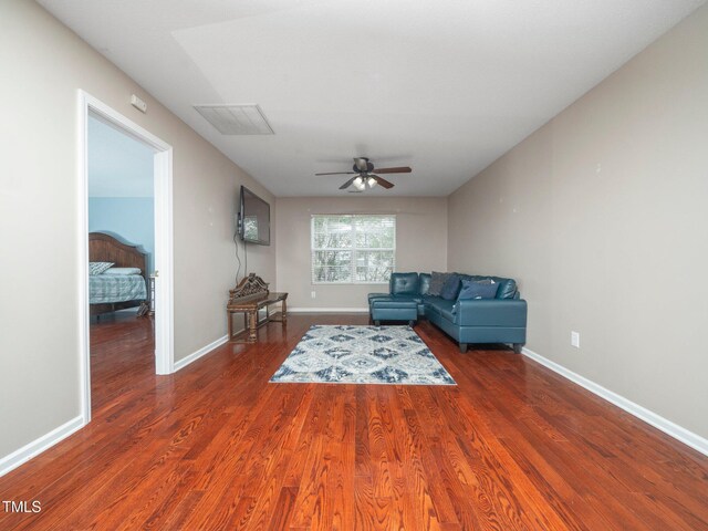 1209 Partington St, Wake Forest, NC 27587 - living area with a ceiling fan, wood finished floors, and baseboards