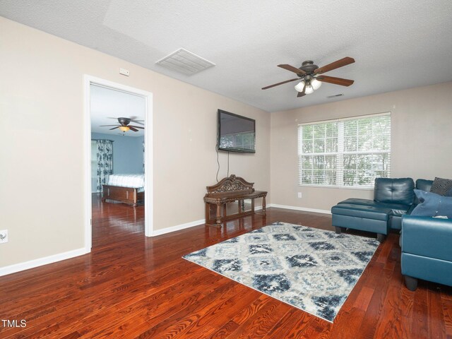 1209 Partington St, Wake Forest, NC 27587 - living room with a ceiling fan, wood finished floors, baseboards, and a textured ceiling