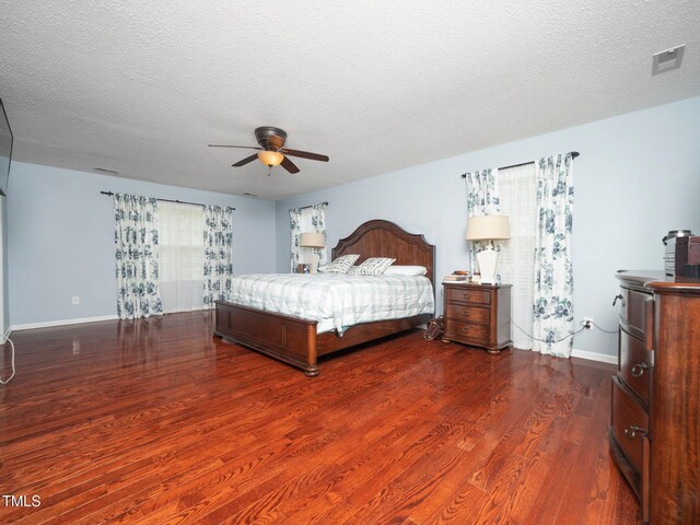 1209 Partington St, Wake Forest, NC 27587 - bedroom featuring dark wood finished floors, baseboards, ceiling fan, and a textured ceiling