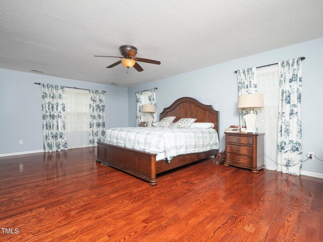 1209 Partington St, Wake Forest, NC 27587 - bedroom featuring wood finished floors, baseboards, a textured ceiling, and ceiling fan