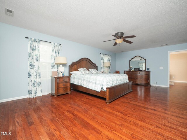 1209 Partington St, Wake Forest, NC 27587 - bedroom with wood finished floors, baseboards, a textured ceiling, and ceiling fan