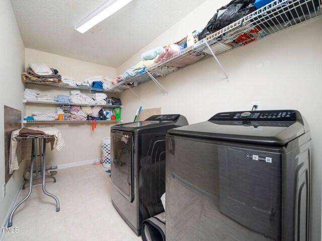 1209 Partington St, Wake Forest, NC 27587 - laundry area with washer and clothes dryer, light floors, and baseboards