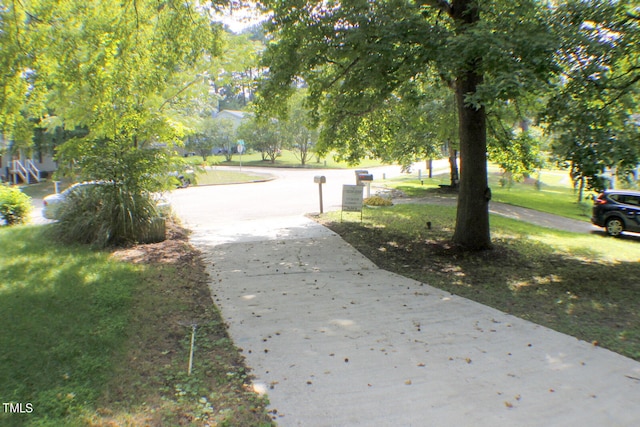 surrounding community with a lawn