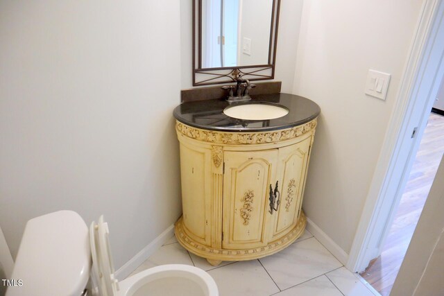 3404 Gemini Dr, Raleigh, NC 27604 - bathroom featuring baseboards, toilet, and vanity