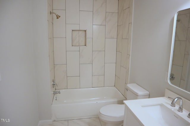 full bathroom with vanity, tile patterned flooring, tiled shower / bath, and toilet