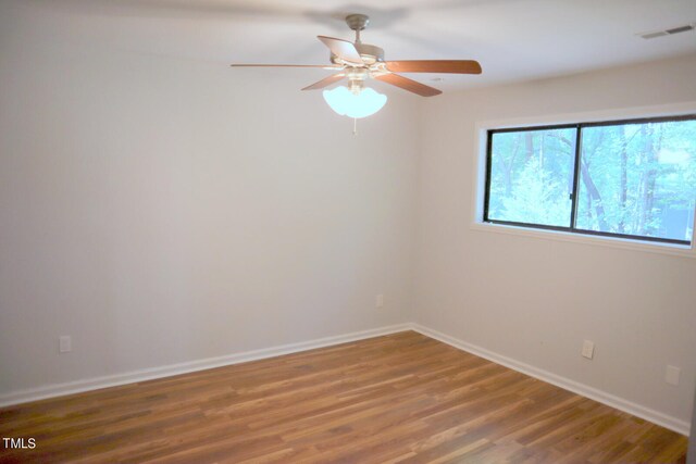 unfurnished room featuring ceiling fan and hardwood / wood-style floors