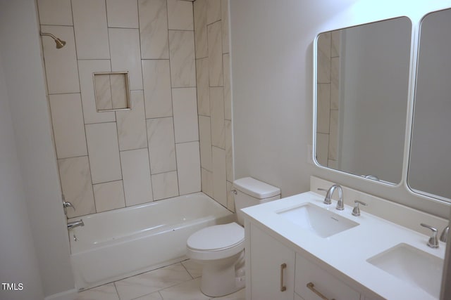 full bathroom featuring tiled shower / bath combo, vanity, and toilet